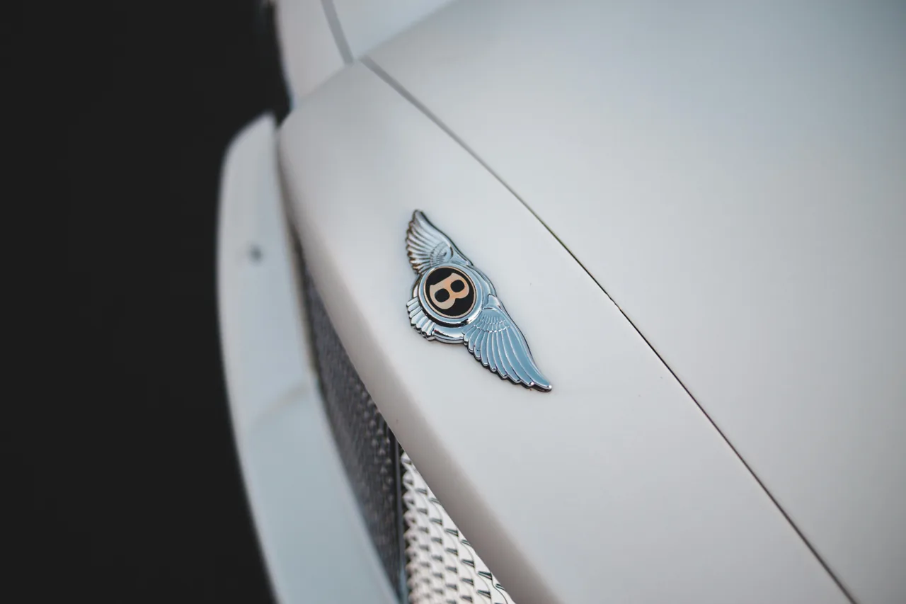 Winged badge on a light-coloured Bentley bonnet