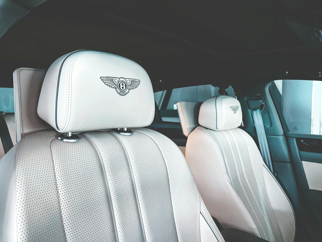 Ivory Bentley seats with embroidered headrests